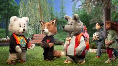 Spirit Bear stand with a fox and a mouse in the forest